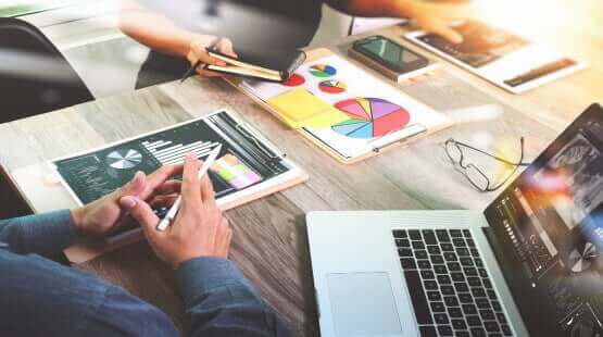 digital marketing strategy at an office, graphs and data