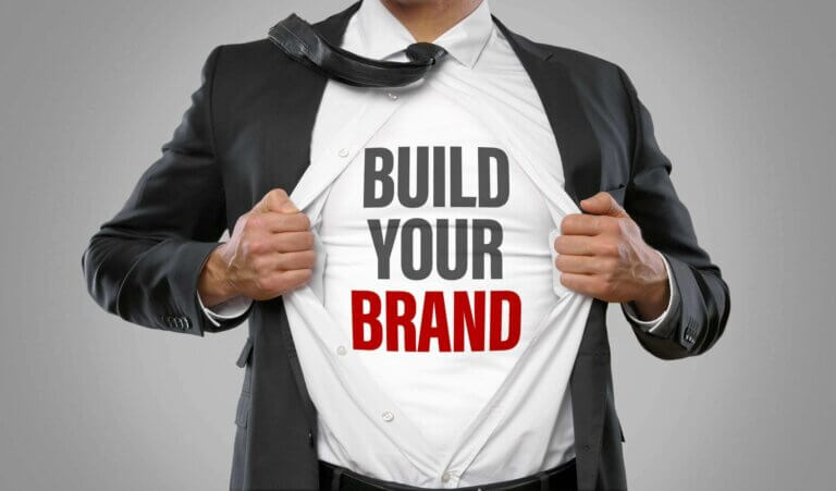 A man wearing a shirt that says "Build Your Brand"