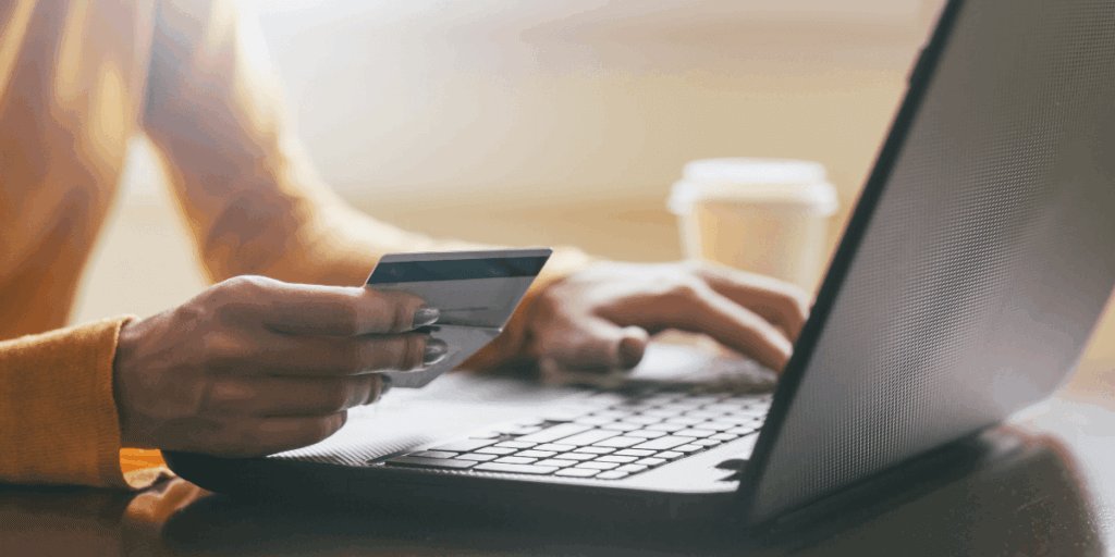 A person using their credit card to make an online purchase